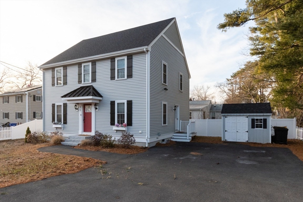 21 Juniper Road Norton, MA 02766 - Photo 2 of 33 a front view of a house with a street