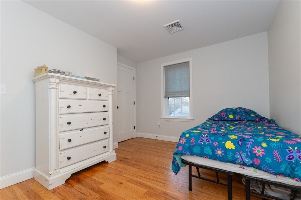 21 Juniper Road Norton, MA 02766 - Photo 26 of 33 a bedroom with a bed and a dresser