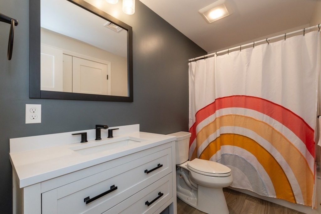 21 Juniper Road Norton, MA 02766 - Photo 29 of 33 a bathroom with a sink a toilet and mirror