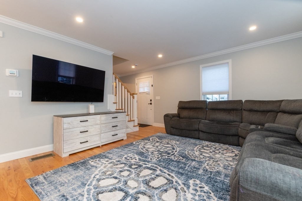 21 Juniper Road Norton, MA 02766 - Photo 4 of 33 a living room with furniture and a flat screen tv
