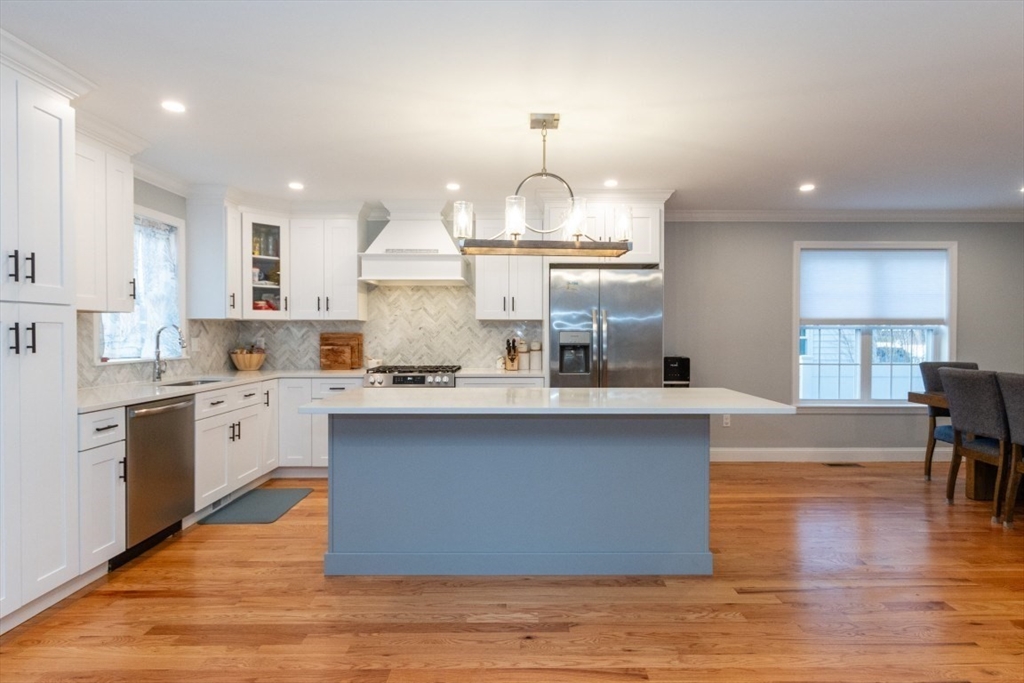 21 Juniper Road Norton, MA 02766 - Photo 9 of 33 a large white kitchen with lots of counter space wooden floor and appliances