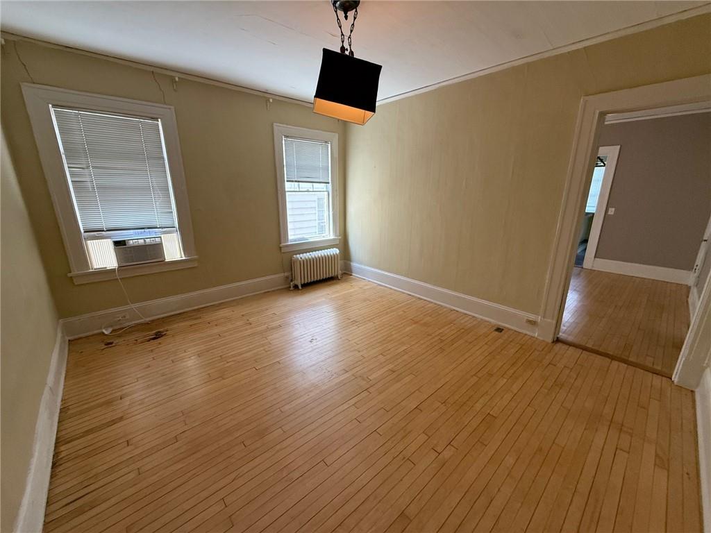 846 Briarcliff Road Northeast Atlanta, GA 30306 - Photo 12 of 22 an empty room with wooden floor and windows