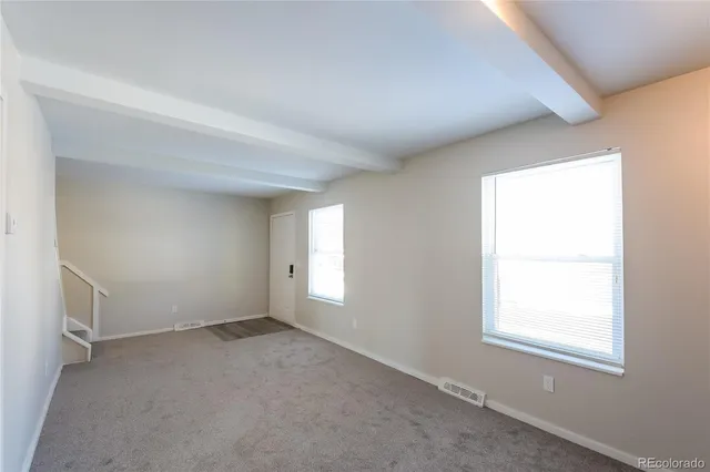 an empty room with windows