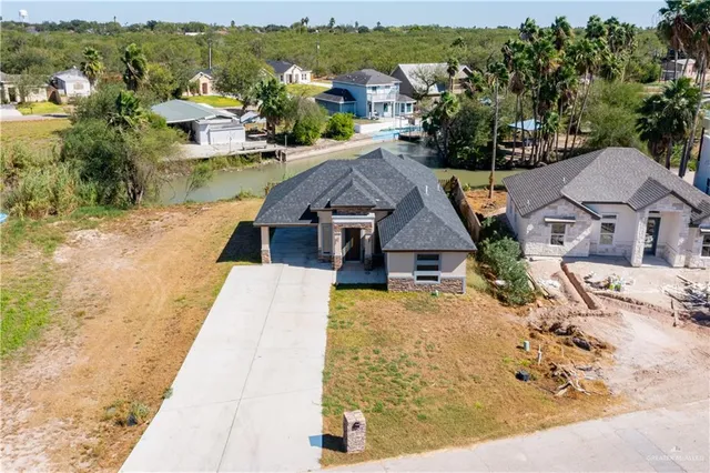 an aerial view of residential houses with outdoor space