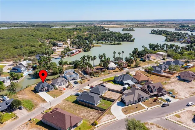 an aerial view of residential building and lake