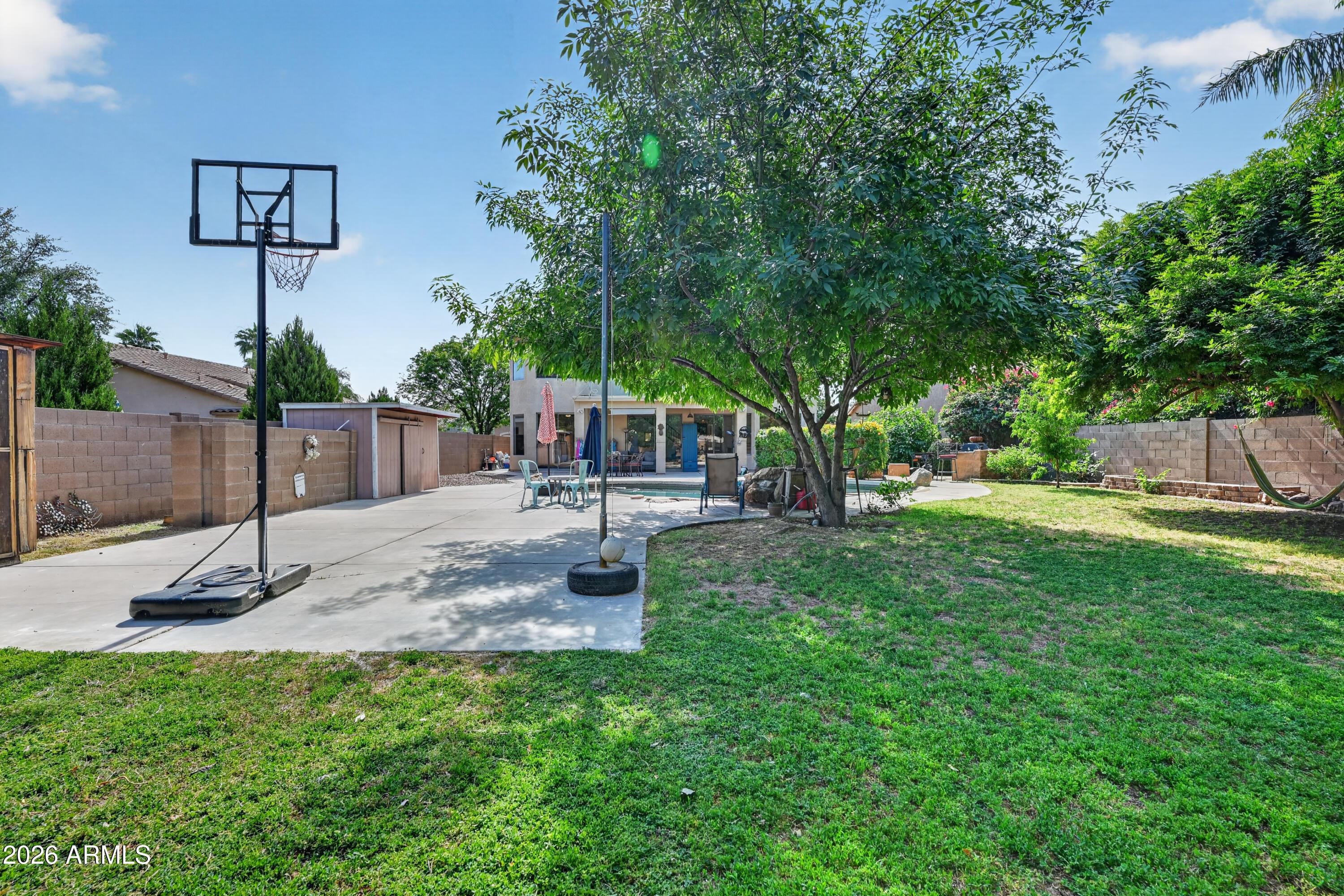 1414 South Sandstone Street Gilbert, AZ 85296 - Photo 14 of 43 a backyard of a house with table and chairs