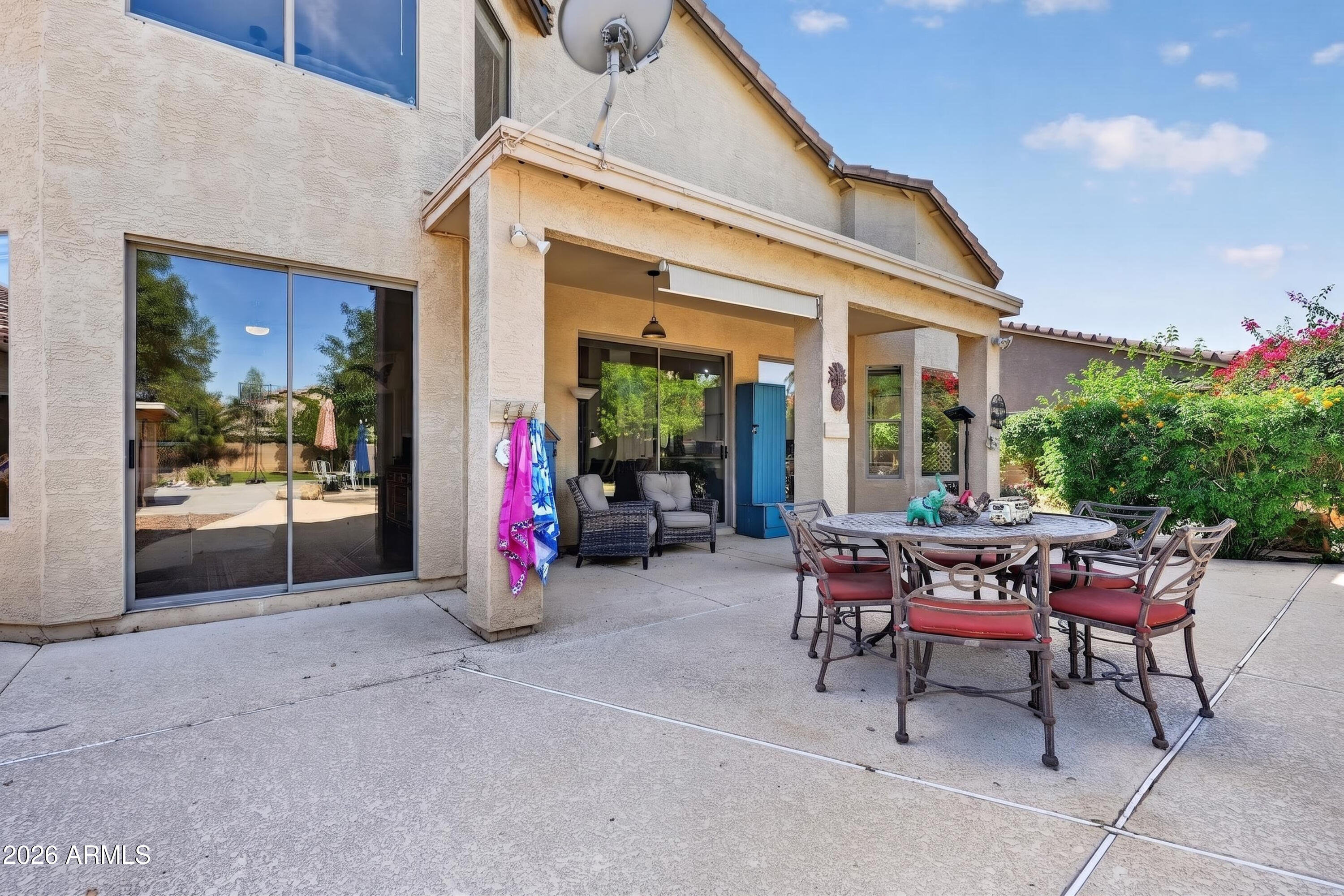 1414 South Sandstone Street Gilbert, AZ 85296 - Photo 17 of 43 a view of a chairs with a table in a patio