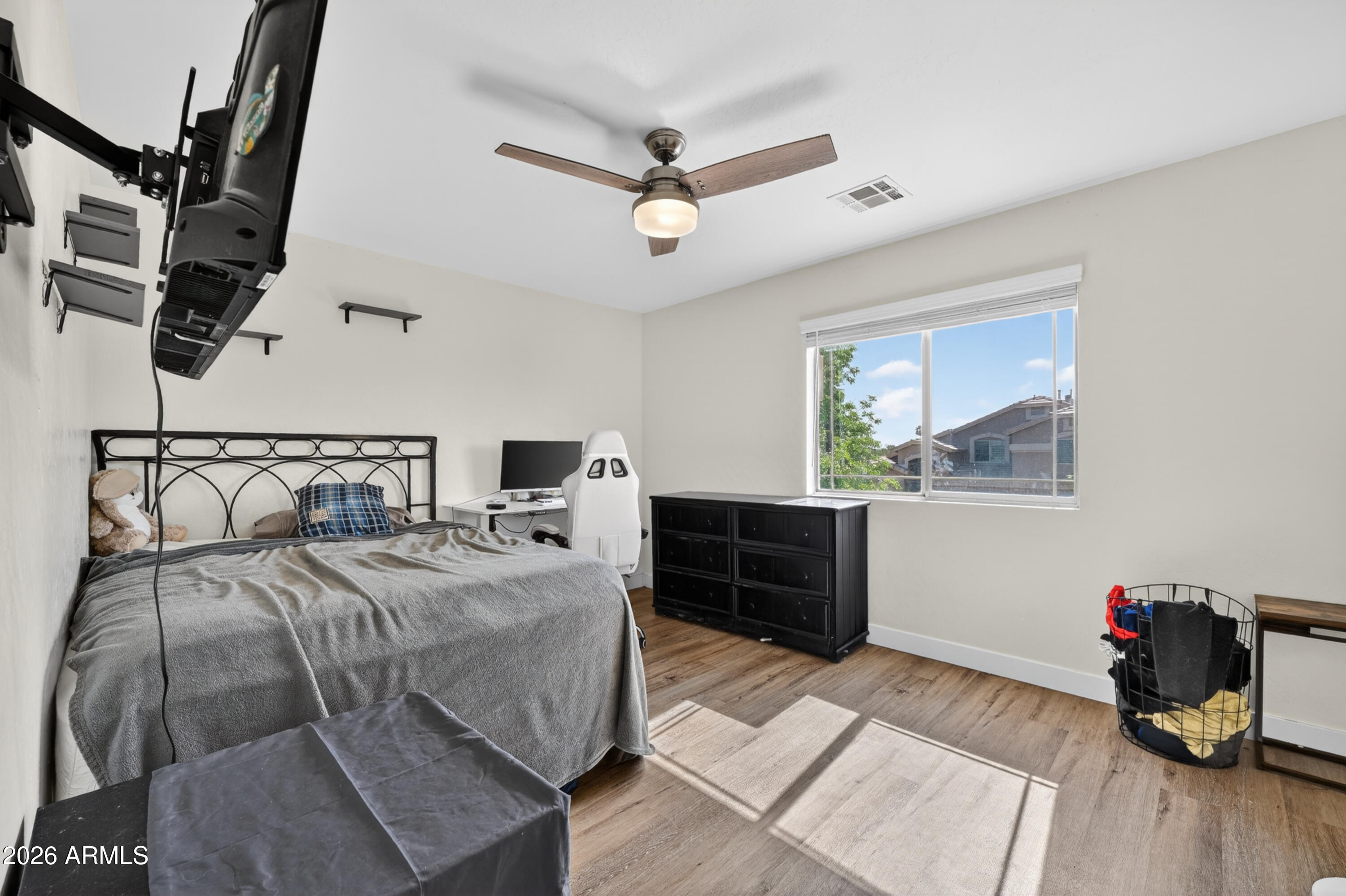 1414 South Sandstone Street Gilbert, AZ 85296 - Photo 31 of 43 a bedroom with a bed and wooden floor