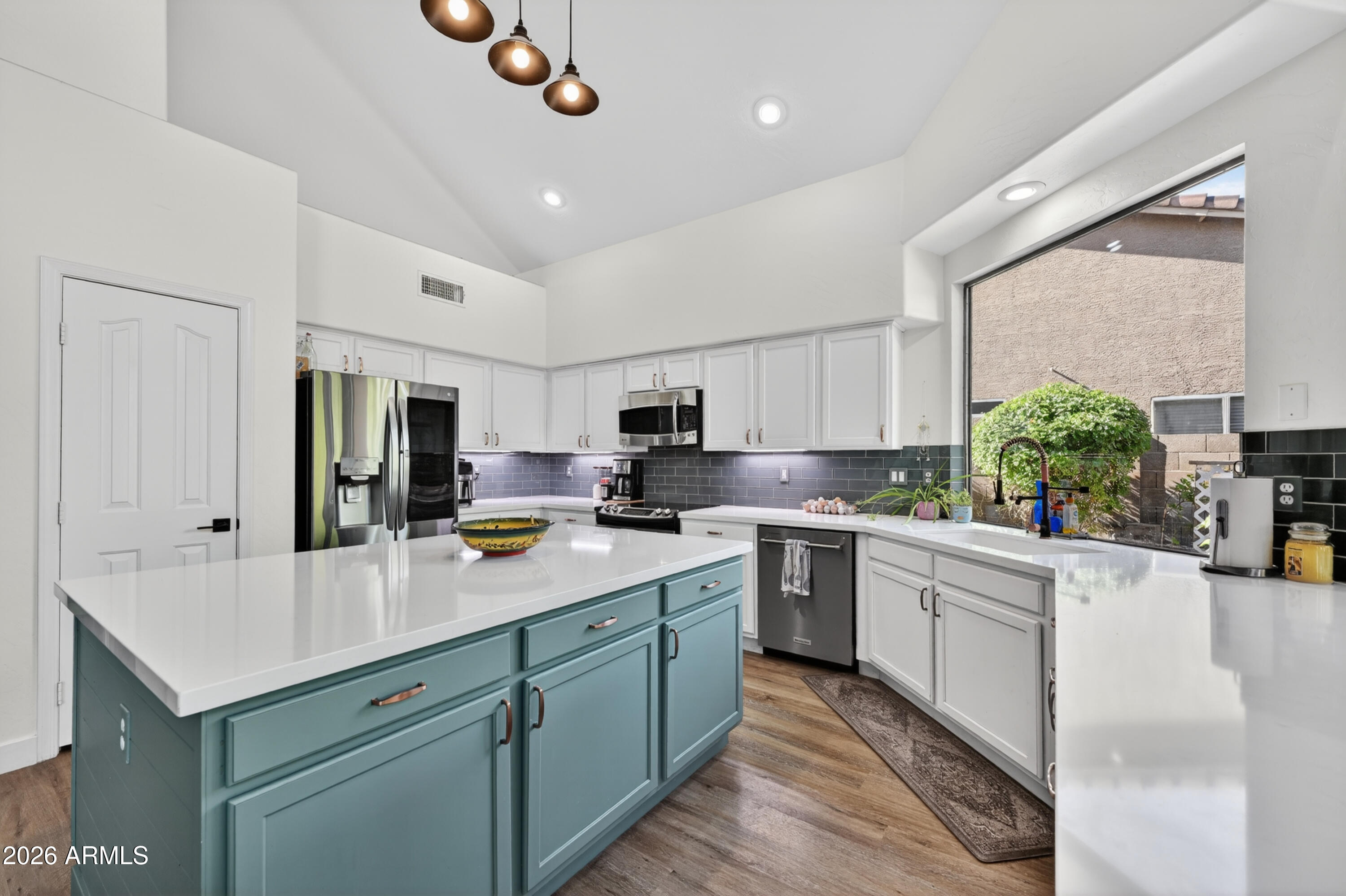 1414 South Sandstone Street Gilbert, AZ 85296 - Photo 6 of 43 a kitchen with a sink counter top space cabinets and stainless steel appliances