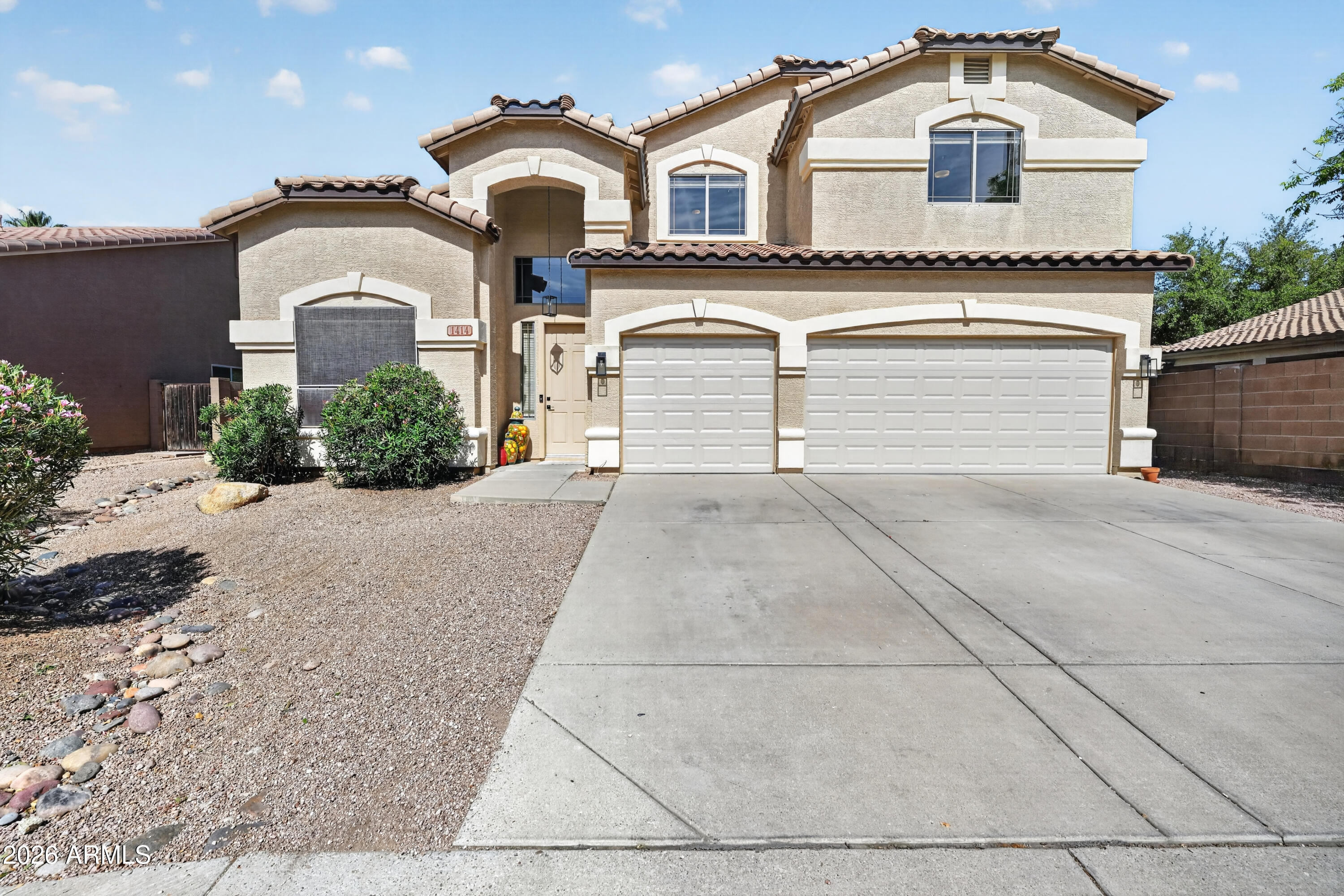 1414 South Sandstone Street Gilbert, AZ 85296 - Photo 10 of 43 a front view of a house with a yard and garage