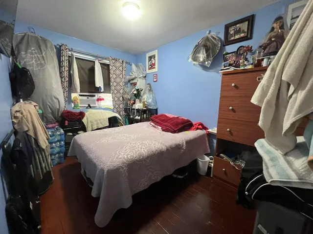 a bed room with a bed and a mirror