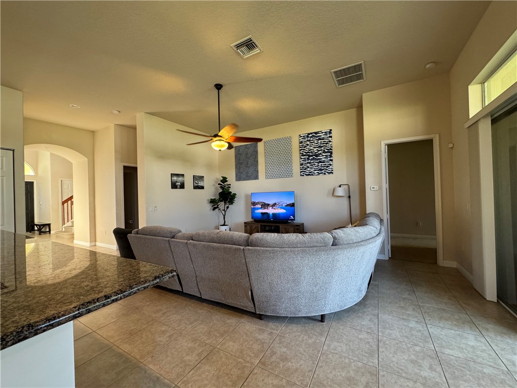 3318 Burlington Place Southwest Vero Beach, FL 32968 - Photo 12 of 30 a living room with furniture and a chandelier