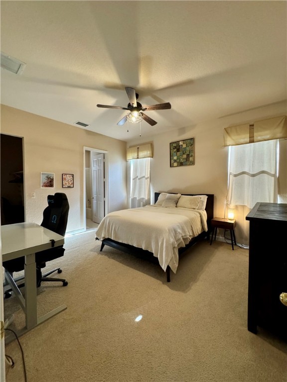 3318 Burlington Place Southwest Vero Beach, FL 32968 - Photo 29 of 30 a bedroom with a bed gym equipment and a chandelier