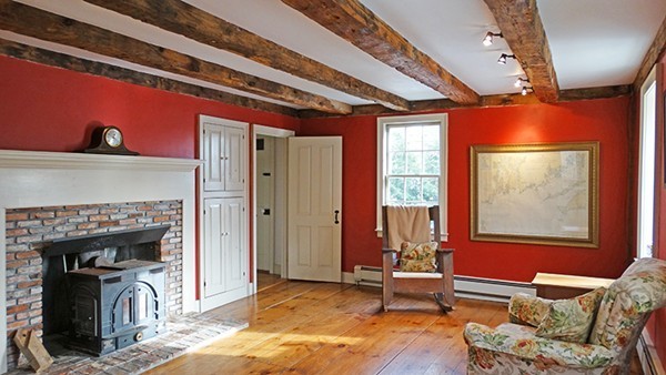 251 New Bedford Road Rochester, MA 02770 - Photo 8 of 22 a living room with furniture a window and a fireplace