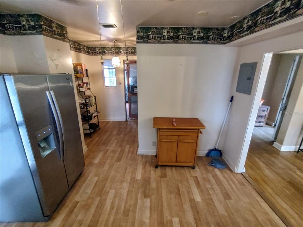 995 West 11th Avenue Mount Dora, FL 32757 - Photo 21 of 49 a view of a hallway with wooden floor