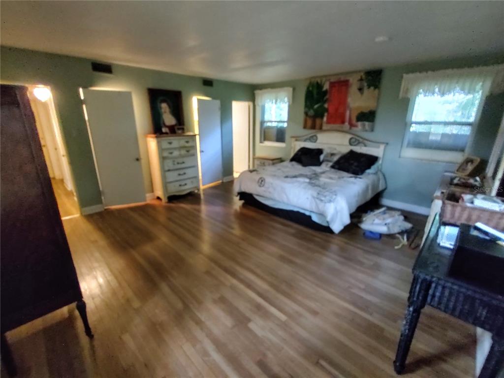 995 West 11th Avenue Mount Dora, FL 32757 - Photo 10 of 49 a living room with furniture and a flat screen tv