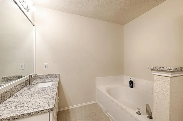 a living room with furniture gym equipment and a large window