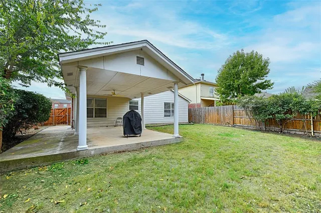 a view of a back yard from a room