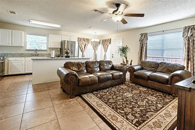 a living room with a couch and a window