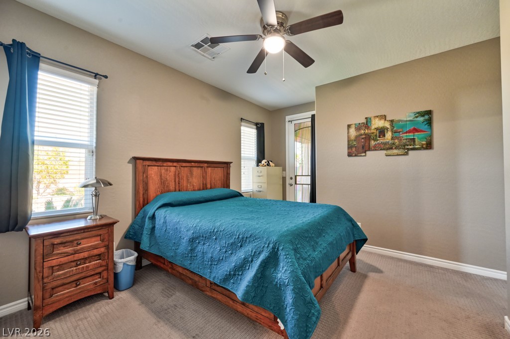 1054 Langston Ranch Avenue Henderson, NV 89002 - Photo 32 of 82 CASITA Bedroom. Can fit a large bed. Secured entry door leads to the lovely outdoors where you can enjoy the spacious backyard.