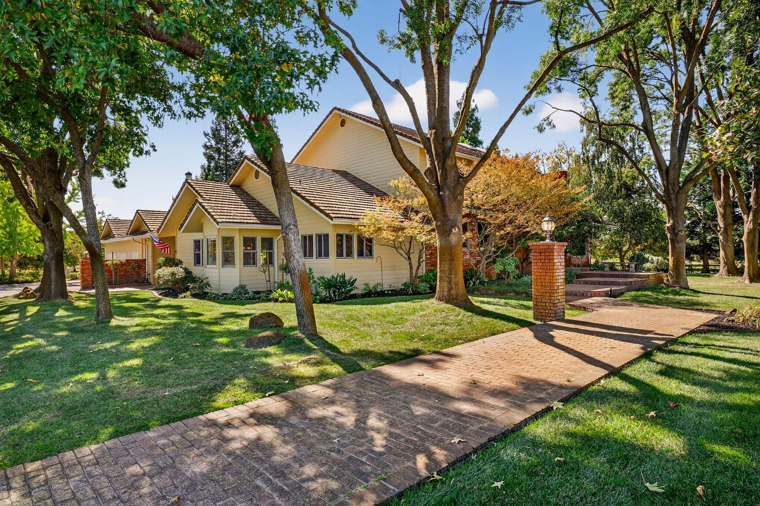 8970 South Butte Road Sutter, CA 95982 - Photo 11 of 86 a front view of a house with a yard and trees