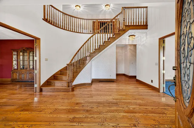a kitchen with granite countertop cabinets stainless steel appliances and a counter space