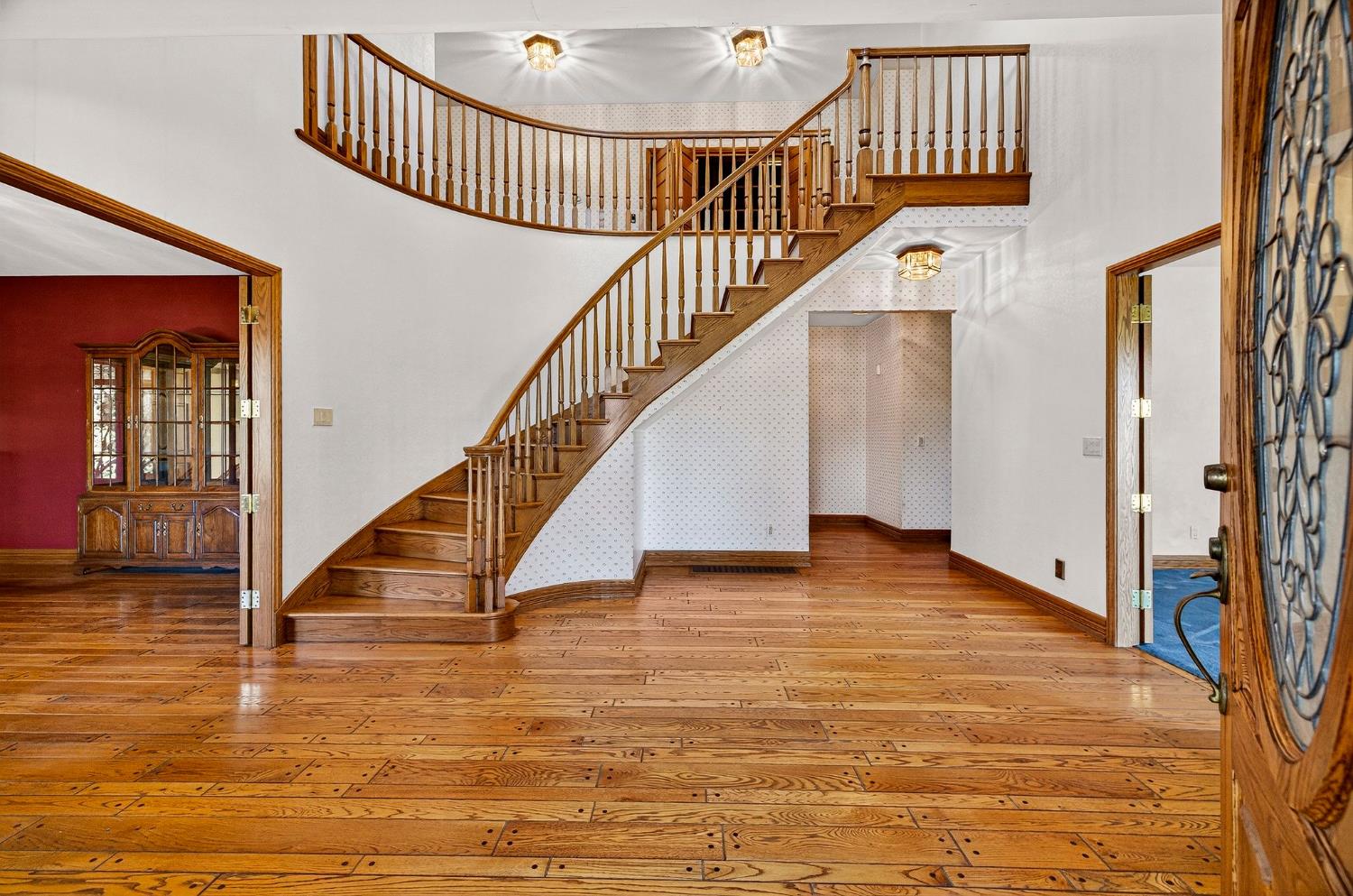 8970 South Butte Road Sutter, CA 95982 - Photo 14 of 86 a view of staircase with lots of frames on wall and a window