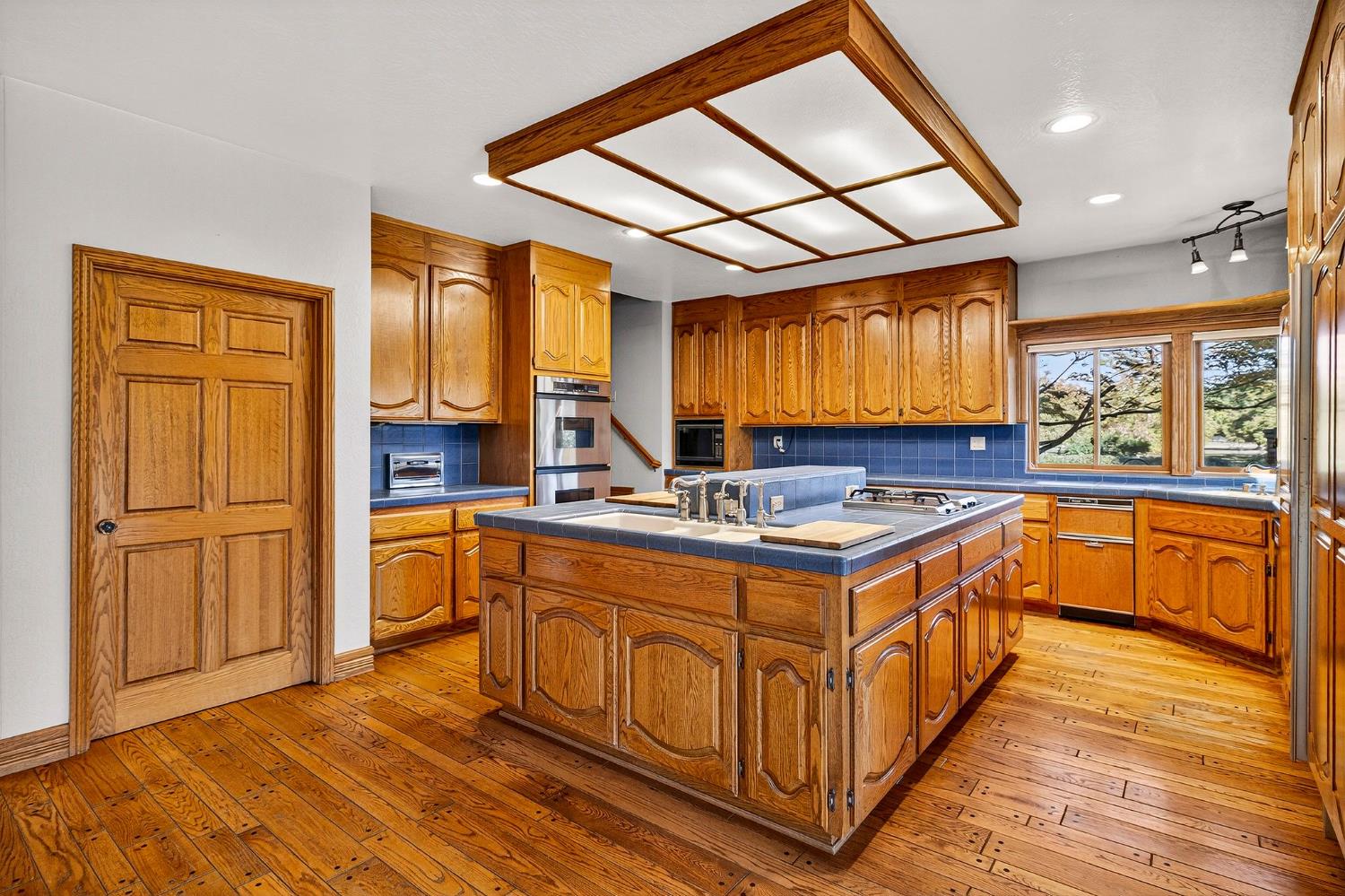 8970 South Butte Road Sutter, CA 95982 - Photo 19 of 86 a kitchen with stainless steel appliances granite countertop a stove a sink and a refrigerator