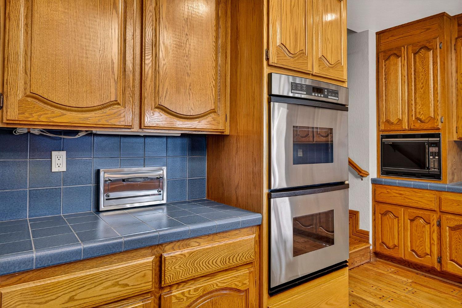8970 South Butte Road Sutter, CA 95982 - Photo 20 of 86 a kitchen with granite countertop cabinets stainless steel appliances and a counter space