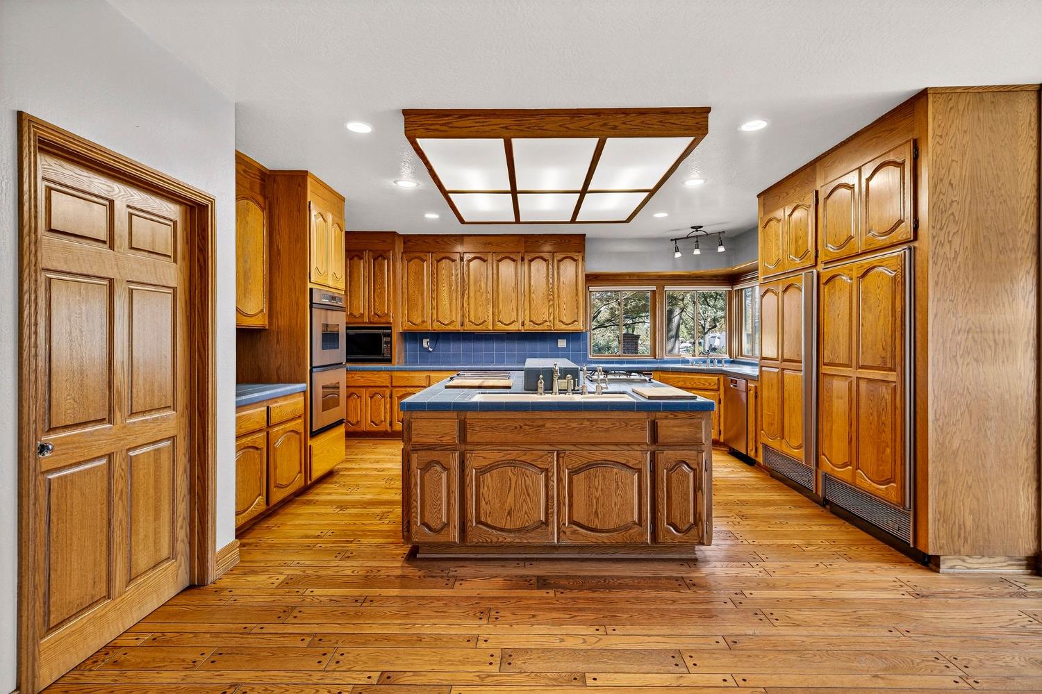 8970 South Butte Road Sutter, CA 95982 - Photo 22 of 86 a kitchen with stainless steel appliances granite countertop a refrigerator a stove and a sink with large cabinets