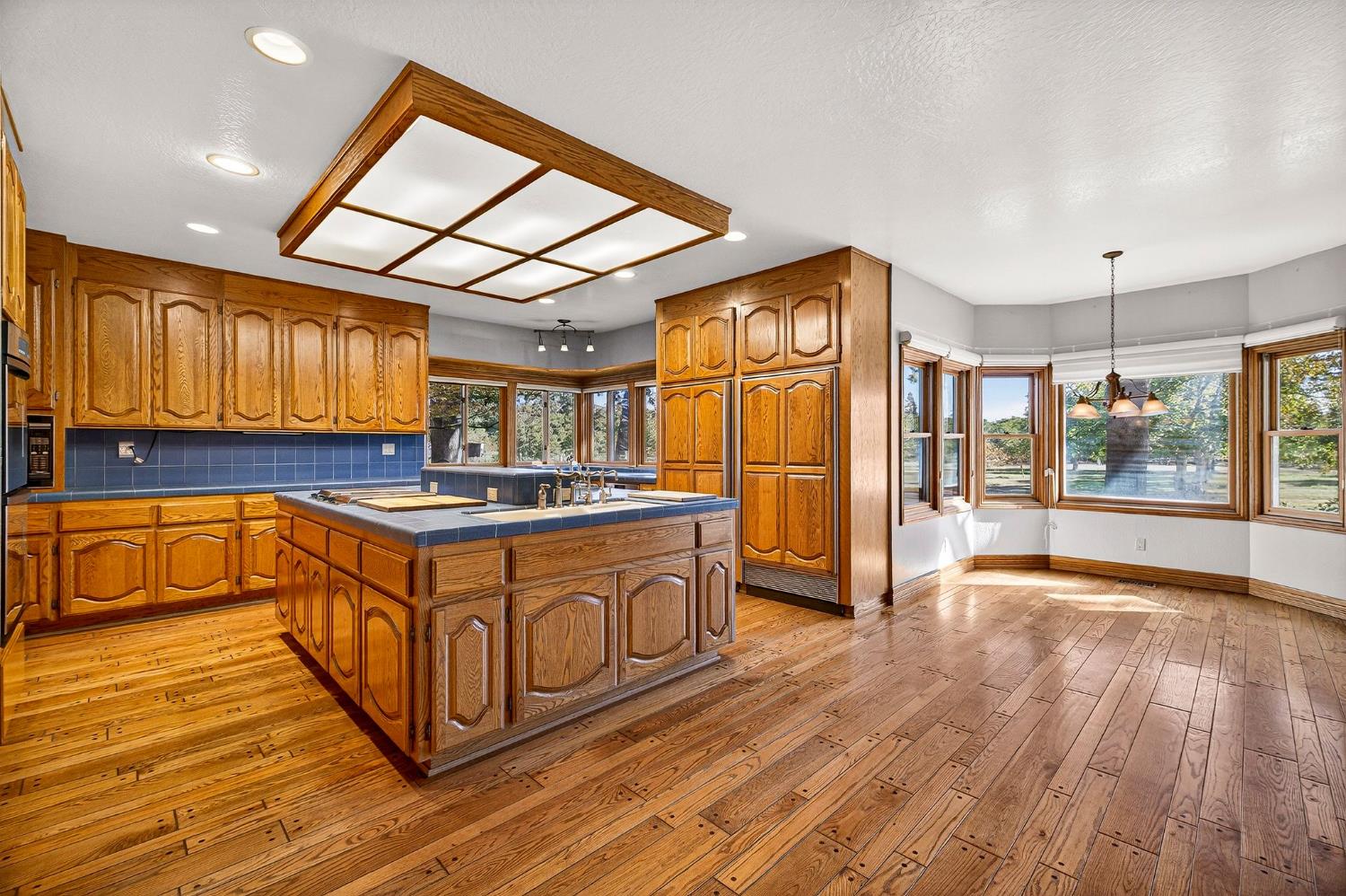 8970 South Butte Road Sutter, CA 95982 - Photo 23 of 86 a kitchen with stainless steel appliances granite countertop a stove a sink and a refrigerator