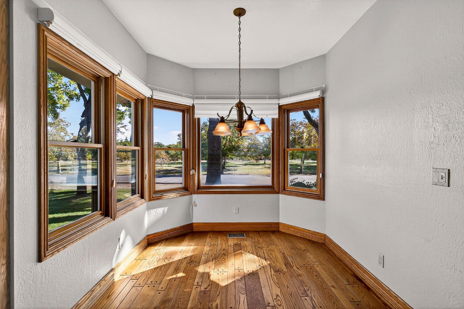 8970 South Butte Road Sutter, CA 95982 - Photo 24 of 86 a view of an empty room with a fireplace and a window