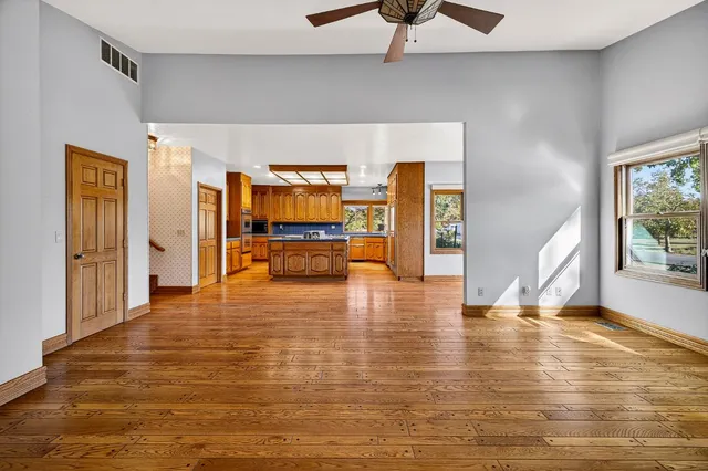 a bathroom with a glass door shower and a mirror