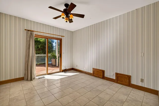 a bathroom with a sink a granite counter tops and a shower