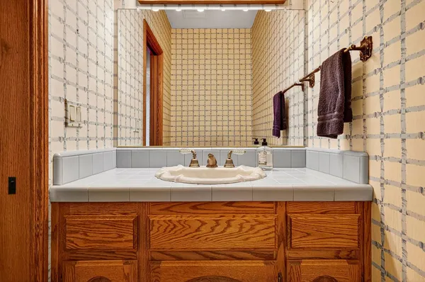 a bathroom with a sink and a mirror