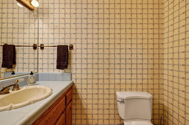 a bathroom with a tub a window and shower