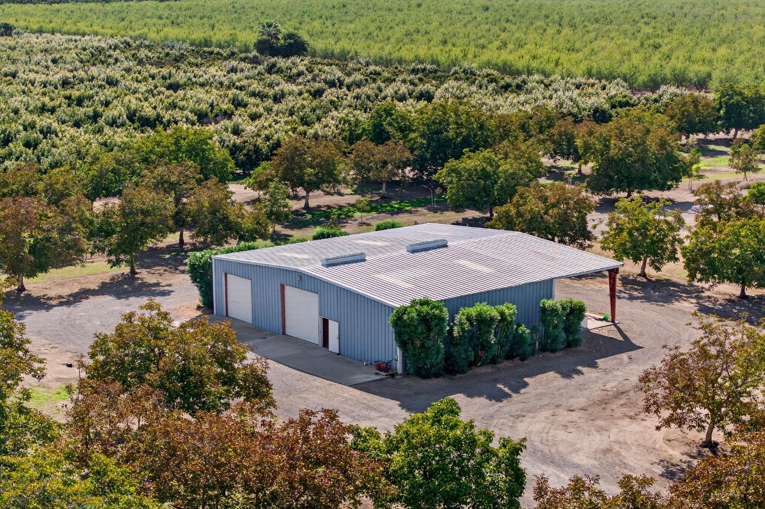8970 South Butte Road Sutter, CA 95982 - Photo 5 of 86 an aerial view of a house with a yard and trees all around