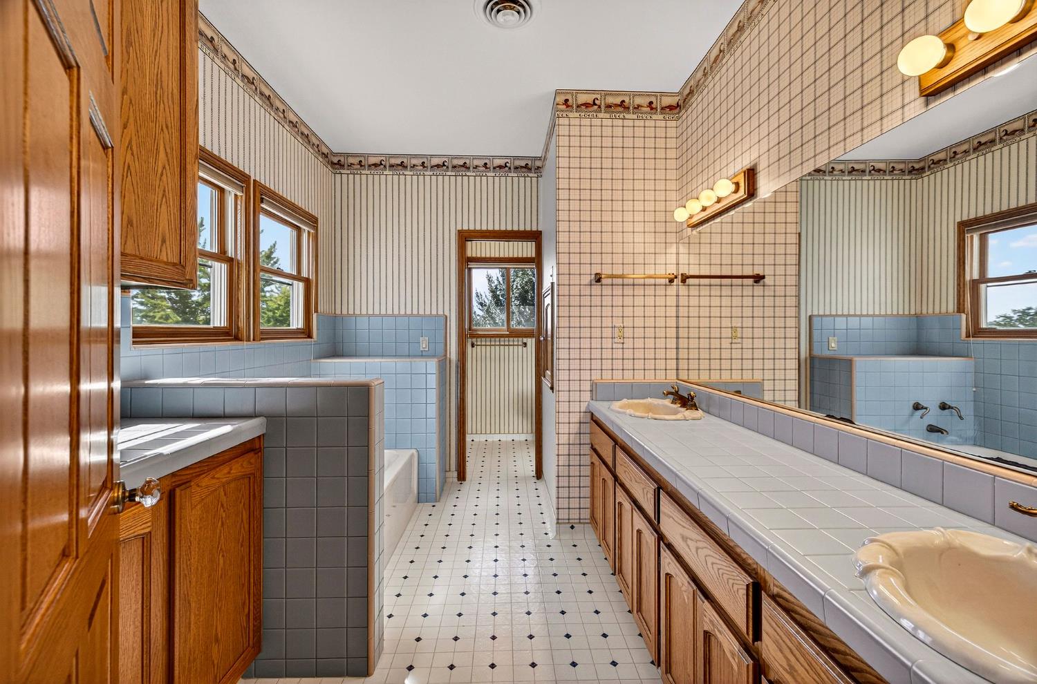 8970 South Butte Road Sutter, CA 95982 - Photo 51 of 86 a bathroom with a sink a granite counter tops and a shower
