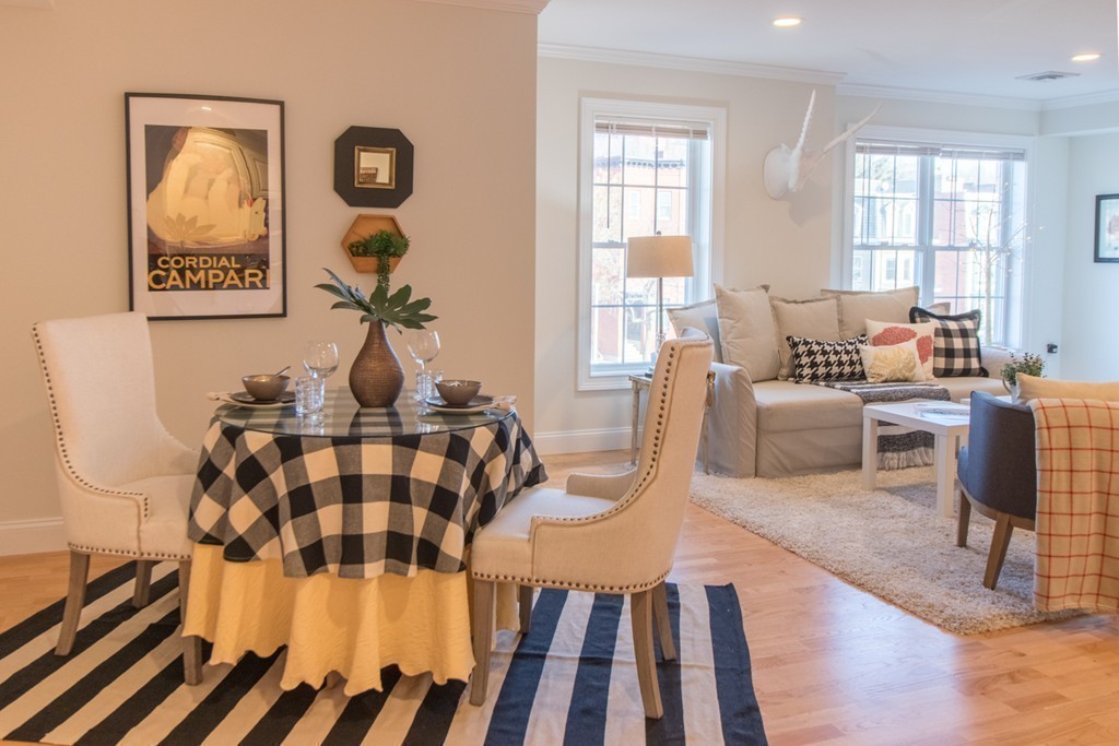 463 Rutherford Avenue, Unit 305 Boston, MA 02129 - Photo 2 of 19 a living room with furniture and wooden floor