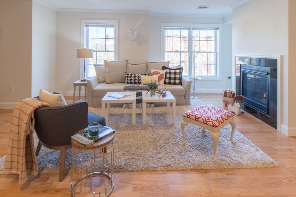 463 Rutherford Avenue, Unit 305 Boston, MA 02129 - Photo 3 of 19 a living room with fireplace furniture and a window
