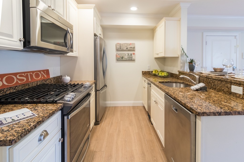 463 Rutherford Avenue, Unit 305 Boston, MA 02129 - Photo 7 of 19 a kitchen with a stove and a microwave