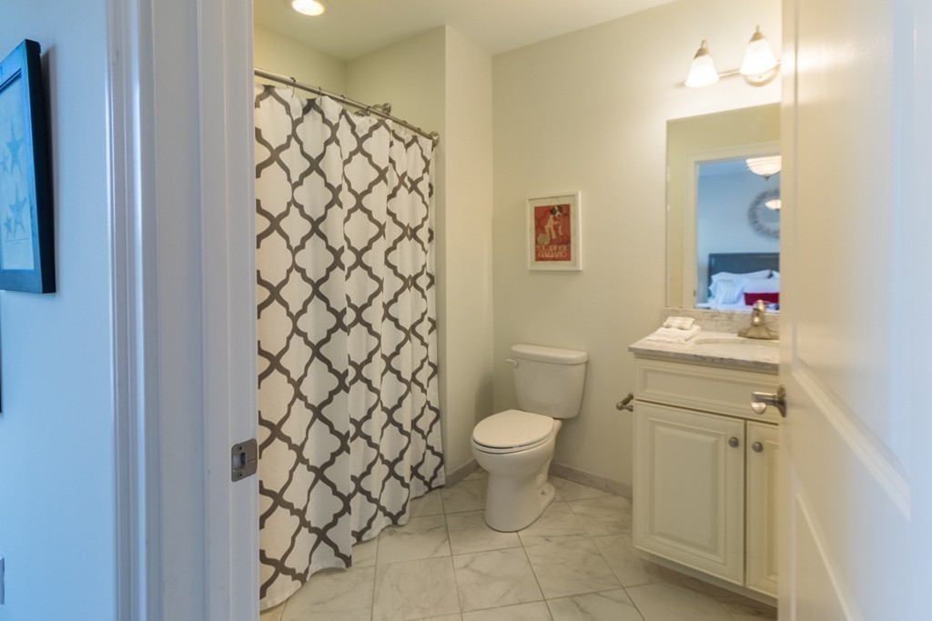 463 Rutherford Avenue, Unit 305 Boston, MA 02129 - Photo 10 of 19 a bathroom with a sink toilet and shower
