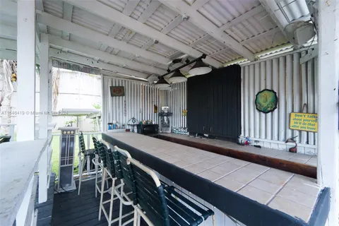 a kitchen with many windows