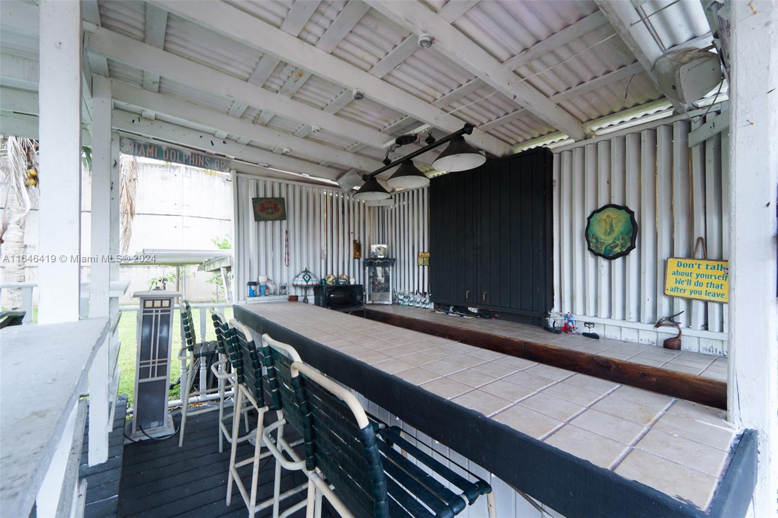 18400 Northeast 7th Court North Miami Beach, FL 33179 - Photo 16 of 24 a kitchen with many windows