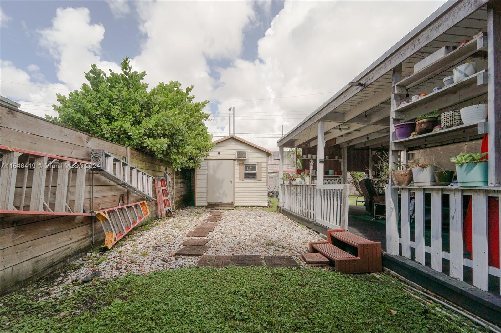 18400 Northeast 7th Court North Miami Beach, FL 33179 - Photo 19 of 24 a view of a house with backyard and porch