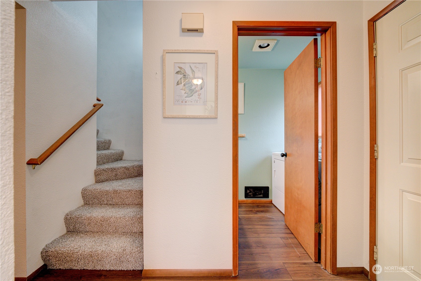 18910 Bothell Everett Highway, Unit J3 Bothell, WA 98012 - Photo 11 of 33 a view of a hallway with wooden floor and entryway