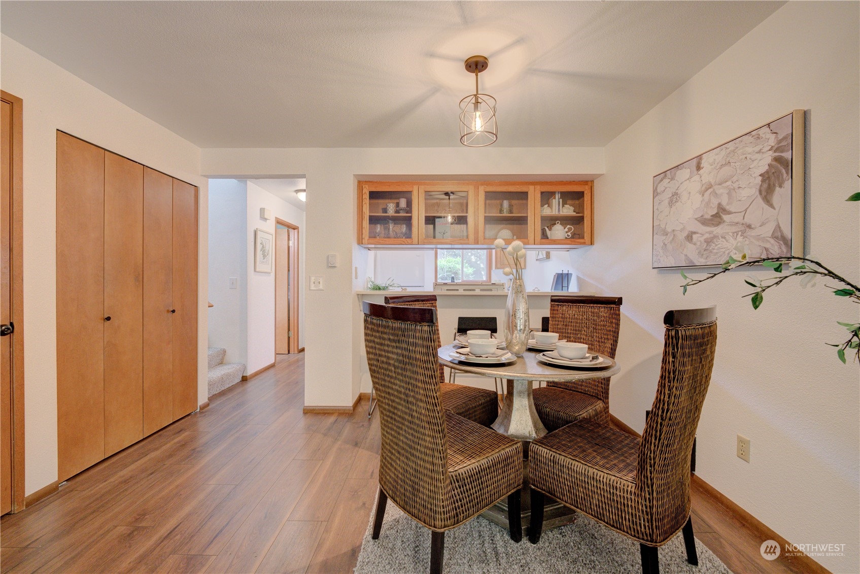 18910 Bothell Everett Highway, Unit J3 Bothell, WA 98012 - Photo 14 of 33 a view of a dining room with furniture window and wooden floor