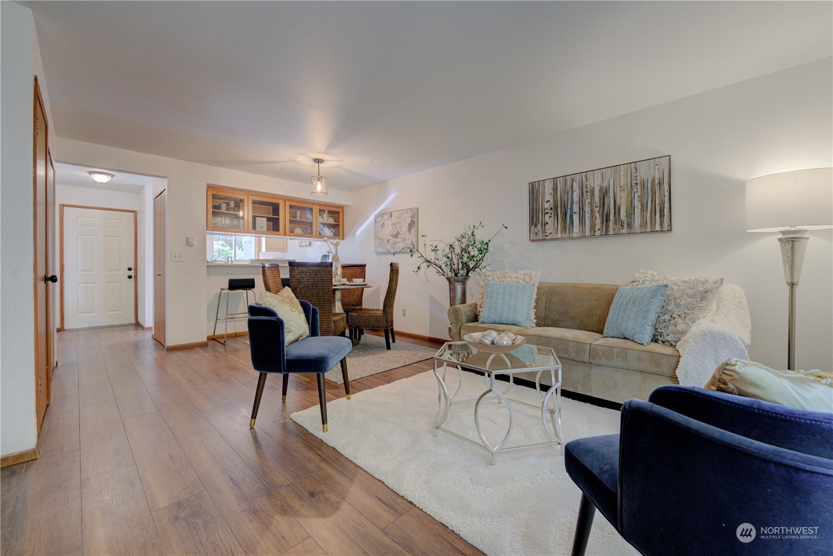 18910 Bothell Everett Highway, Unit J3 Bothell, WA 98012 - Photo 19 of 33 a living room with furniture and a wooden floor