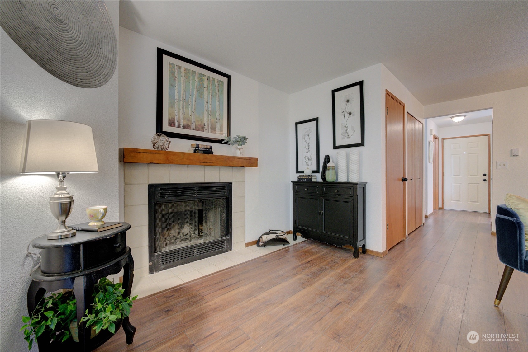18910 Bothell Everett Highway, Unit J3 Bothell, WA 98012 - Photo 21 of 33 a living room with furniture and a fireplace