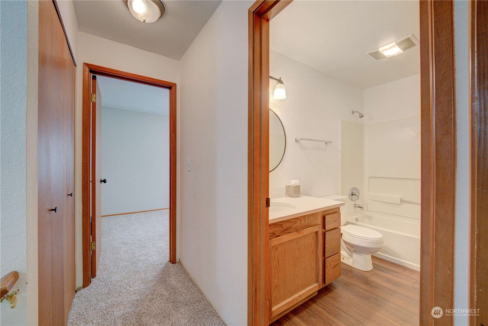 18910 Bothell Everett Highway, Unit J3 Bothell, WA 98012 - Photo 23 of 33 a bathroom with a sink a toilet and a view of bathroom